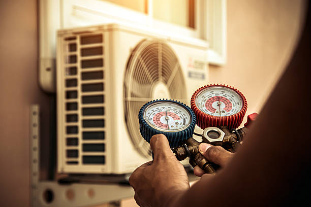 Professional Heat Pump Repair technician working in Holly Ridge, NC